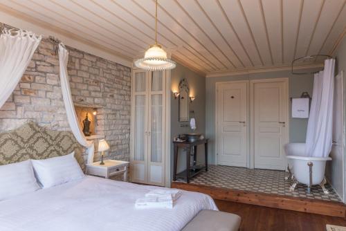Ένα ή περισσότερα κρεβάτια σε δωμάτιο στο Primoula Country Hotel & Spa