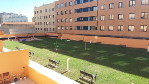 a playground on the roof of a building with benches at Matosinhos Relax and Fun by PortoProperties4You in Matosinhos