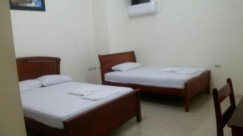 Voodi või voodid majutusasutuse Hotel Jira toas