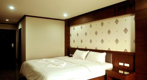 Postel nebo postele na pokoji v ubytování Green Hill Hotel Phayao