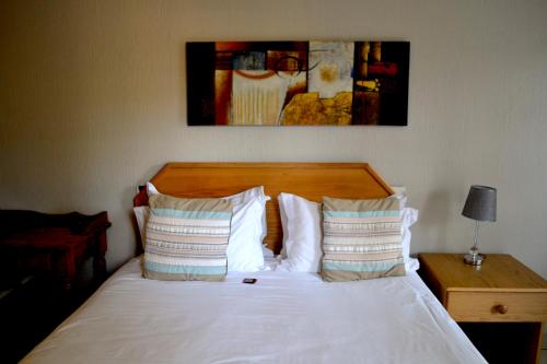 Ένα ή περισσότερα κρεβάτια σε δωμάτιο στο The Bedford View Guest House