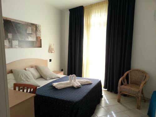 Cama o camas de una habitación en Hotel Profumo Di Mare