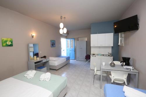 a living room with two beds and a kitchen at Blue Sky in Galissas