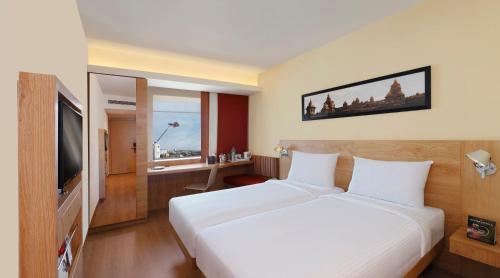 Postel nebo postele na pokoji v ubytování Ibis Chennai OMR - An Accor Brand