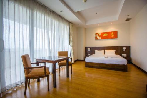Ένα ή περισσότερα κρεβάτια σε δωμάτιο στο Grande Southern Hotel