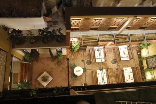an overhead view of a building with plants at Mangaldas Ni Haveli II by The House of MG in Ahmedabad