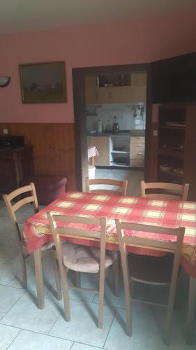 a table and chairs in a kitchen with a table and chairsktop at Šumavská Barborka in Vimperk
