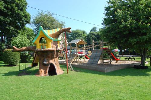 a playground with a play structure in a park at Sorrel Horse Inn in Ipswich