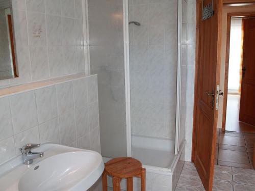 a bathroom with a shower and a sink and a toilet at Tranquil Holiday Home in Zingst Germany with Terrace in Zingst