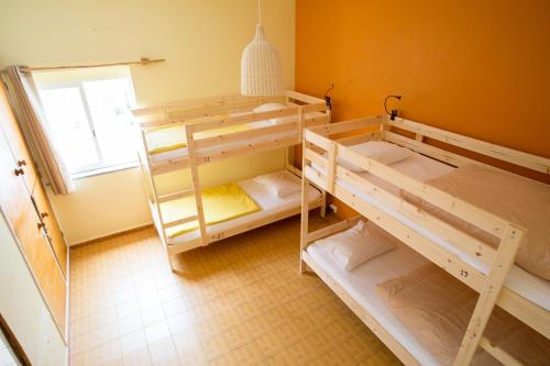 Katil atau katil-katil dalam bilik di Good Feeling Hostel & Guest House
