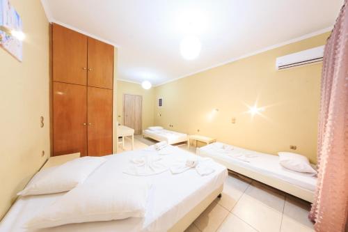 Ένα ή περισσότερα κρεβάτια σε δωμάτιο στο Zante Bay Studios