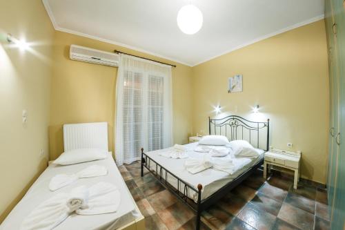Ένα ή περισσότερα κρεβάτια σε δωμάτιο στο Zante Bay Studios