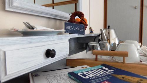 a kitchen counter with a book on a table at La Casa di Enrico in Caorle