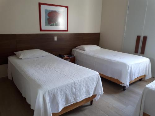 Ένα ή περισσότερα κρεβάτια σε δωμάτιο στο Hotel Plenotel