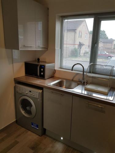 Kuchyň nebo kuchyňský kout v ubytování Columbine, Thetford, 2BR House