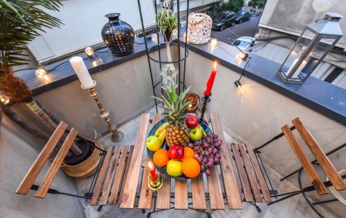 a bowl of fruit sitting on a table at Parliament & River View Apartments in Bucharest