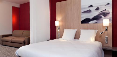 Ένα ή περισσότερα κρεβάτια σε δωμάτιο στο ibis Styles Troyes Centre