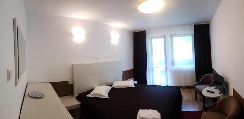 En eller flere senge i et værelse på Hotel Paraul Capra