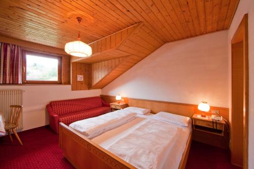 Ένα ή περισσότερα κρεβάτια σε δωμάτιο στο Hotel Rainegg