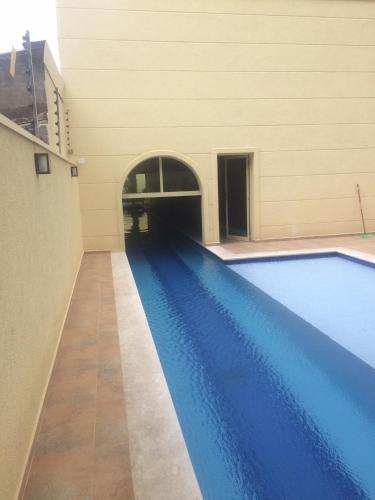 an empty swimming pool in a building at Anitta 2 in Sao Paulo