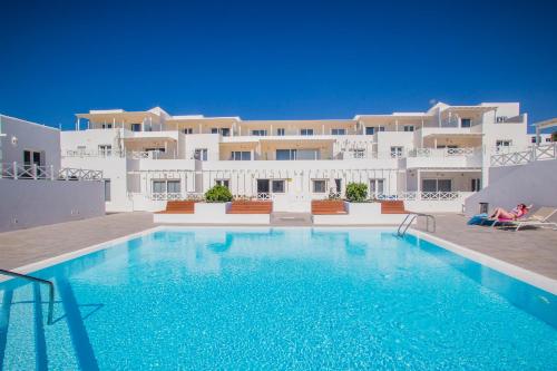 a large swimming pool in front of a building at Flower Beach Suite 25 in Playa Honda