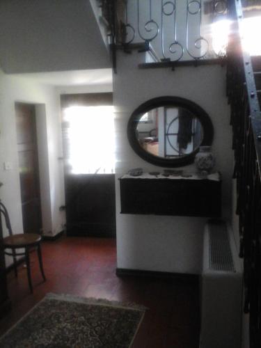 a living room with a mirror and a table at Cà Morari in Argenta