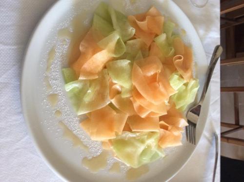 a plate of food with a fork and vegetables at Palazzo Muro Leccese Relais de Charme & Wellness in Muro Leccese