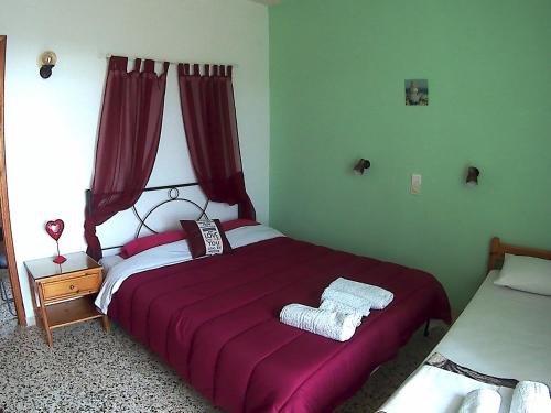 Una cama o camas en una habitación de Eri Studios