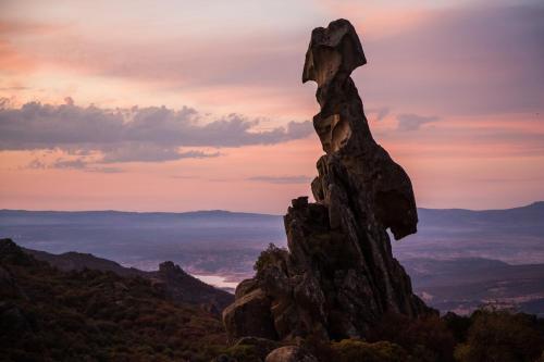 a rock formation on top of a mountain at sunset at La Piazzetta in Austis
