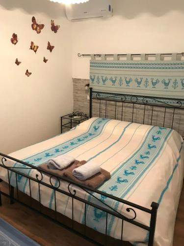 Ein Bett oder Betten in einem Zimmer der Unterkunft La Piazzetta