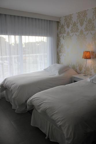 Yoo Punta del Este - Rental Club Apartmentsにあるベッド