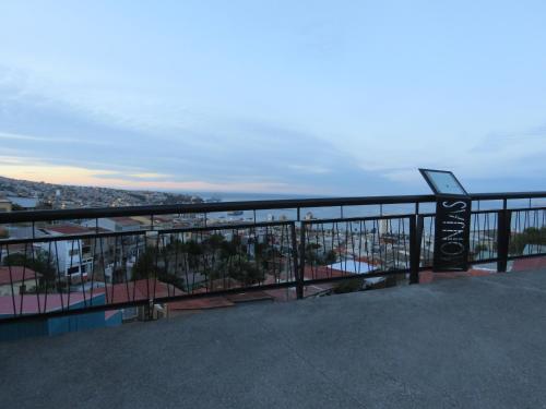 a balcony with a view of a city at Hostal Mirenart in Valparaíso
