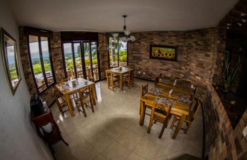 an aerial view of a restaurant with tables and chairs at Hotel Tata Premium in Pueblo Tapao