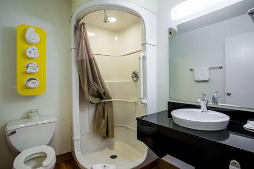 a bathroom with a white toilet and a sink at Motel 6-Prescott, AZ in Prescott