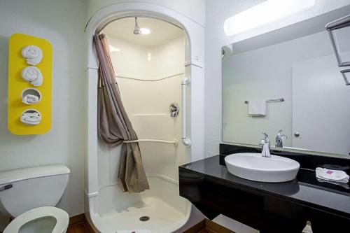 a bathroom with a sink and a toilet and a mirror at Motel 6-Prescott, AZ in Prescott
