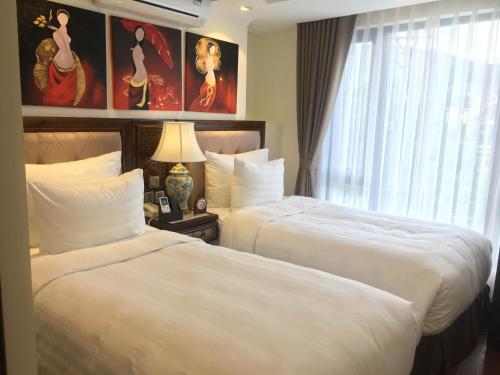 Giường trong phòng chung tại Paris Boutique Hotel Sapa