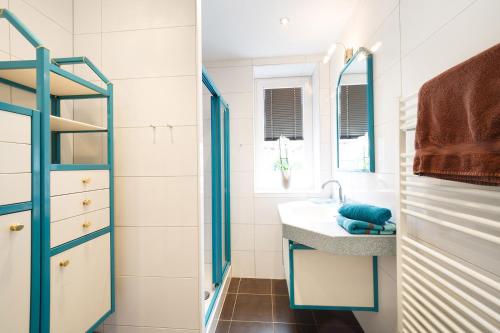 a bathroom with a sink and a mirror at Apartment Warter in Schladming