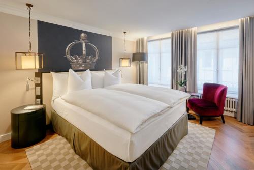 Ein Bett oder Betten in einem Zimmer der Unterkunft Sorell Hotel Krone
