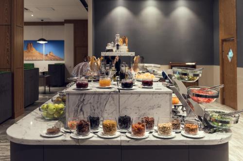 a buffet of desserts and food on a table at Wyndham Garden Astana in Astana