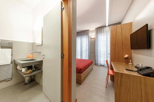 Telewizja i/lub zestaw kina domowego w obiekcie Le Scuole B&B - by ColleMassari Hospitality