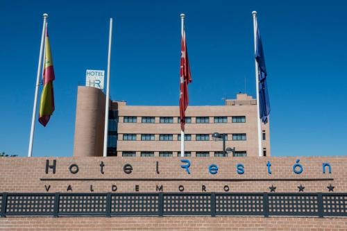 a building with three flags in front of it at Hotel Reston Valdemoro in Valdemoro