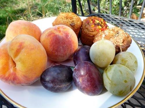 a plate of fruits and vegetables on a table at Cycle Inn Bed and Breakfast in Langford