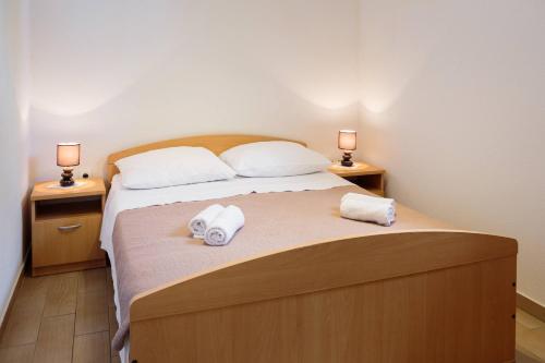 Ένα ή περισσότερα κρεβάτια σε δωμάτιο στο Pavao Apartments
