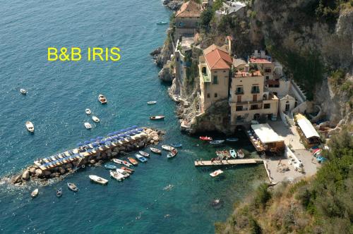 a group of boats in a body of water at B&B Iris in Conca dei Marini