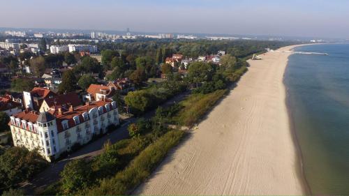 an aerial view of a beach and a building at Hotel Lival in Gdańsk