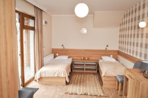 Ένα ή περισσότερα κρεβάτια σε δωμάτιο στο ZAKĄTEK