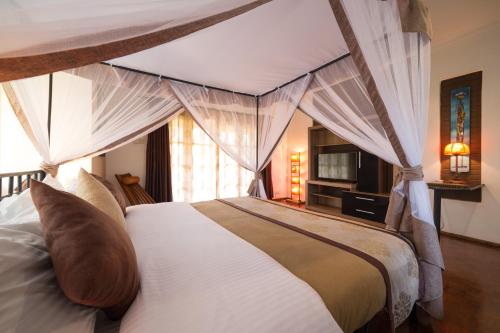 Кровать или кровати в номере Ameg Lodge Kilimanjaro