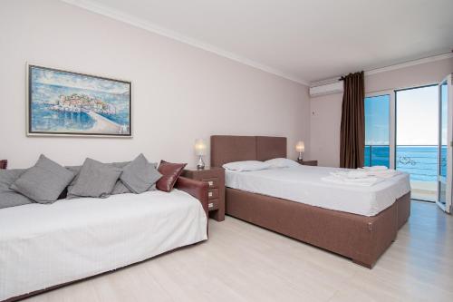 Postel nebo postele na pokoji v ubytování Open Sea Apartments
