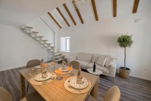 a living room with a table and a couch at Feel like an Emperor Apartments in Split
