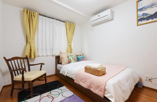 Una cama o camas en una habitación de Haneda Luxury House